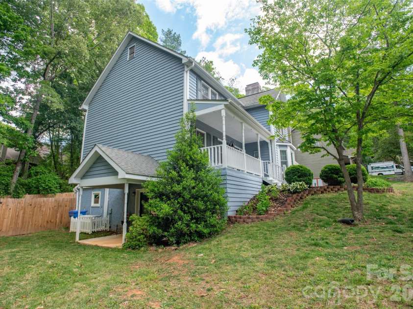 1002 Windsor Drive, Asheville, NC 28803.  MLS# CAR4413516, YatesRealty ID 21960. Side view with porch