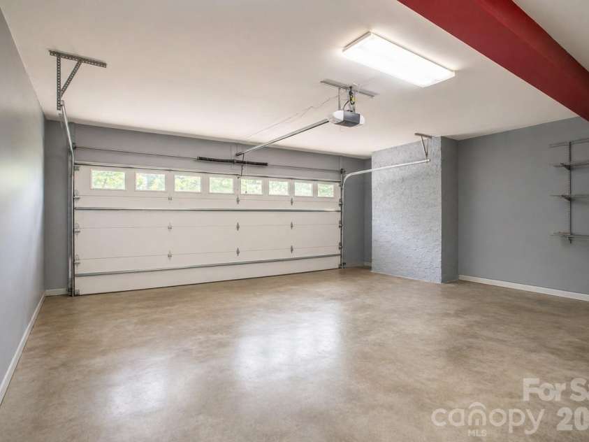 1002 Windsor Drive, Asheville, NC 28803.  MLS# CAR4413516, YatesRealty ID 21960. Staged garage