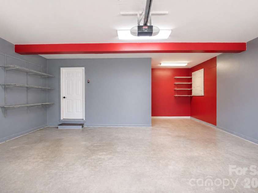 1002 Windsor Drive, Asheville, NC 28803.  MLS# CAR4413516, YatesRealty ID 21960. Staged garage