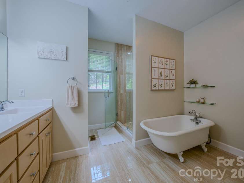 9 Double Eagle Drive, Weaverville, NC 28787.  MLS# CAR4367152, YatesRealty ID 21962. Primary bath with claw foot tub