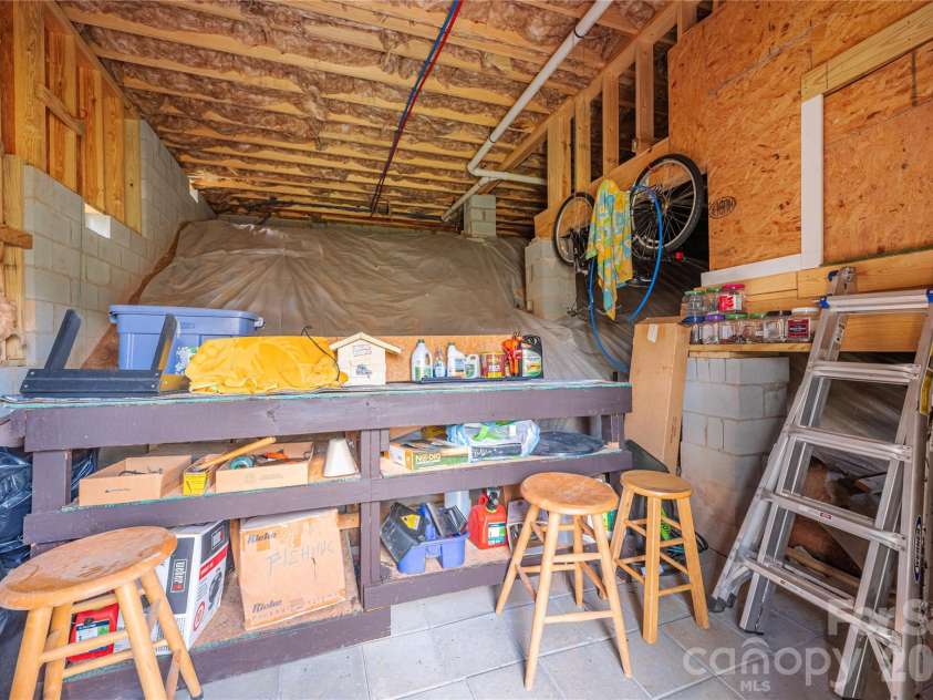 311 Wild Ginger Court, Weaverville, NC 28787.  MLS# CAR4366026, YatesRealty ID 21963. Crawlspace Workshop/Storage