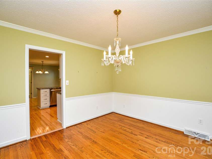 2922 Butter Churn Lane, Matthews, NC 28105.  MLS# CAR4361303, YatesRealty ID 21985. Dining room opens into kitchen 