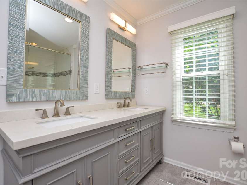 2922 Butter Churn Lane, Matthews, NC 28105.  MLS# CAR4361303, YatesRealty ID 21985. Updated en suite primary bath  