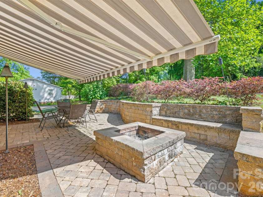 5821 Rowan Way, Charlotte, NC 28214.  MLS# CAR4380233, YatesRealty ID 21987. Pavers Patio with Firepit for Entertaining 