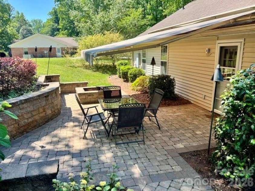 5821 Rowan Way, Charlotte, NC 28214.  MLS# CAR4380233, YatesRealty ID 21987. Sitting Area on Patio and Retaining Wall