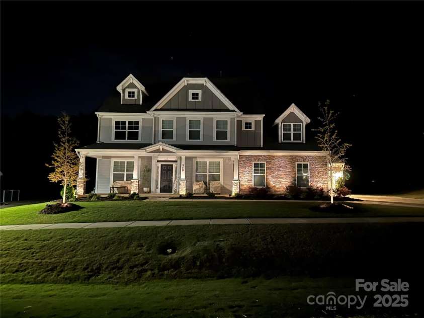 849 Yucatan Drive, Waxhaw, NC 28173.  MLS# CAR4281453, YatesRealty ID 2199. Property at night w/ landscape lighting
