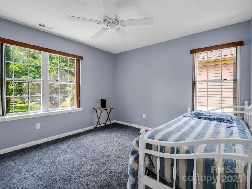 114 Fairway View Drive, Etowah, NC 28729.  MLS# CAR4270045, YatesRealty ID 21996. 2nd bedroom with lots of natural light.