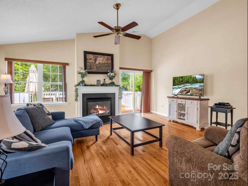 114 Fairway View Drive, Etowah, NC 28729.  MLS# CAR4270045, YatesRealty ID 21996. Living Room with Sliding Doors to Back Deck