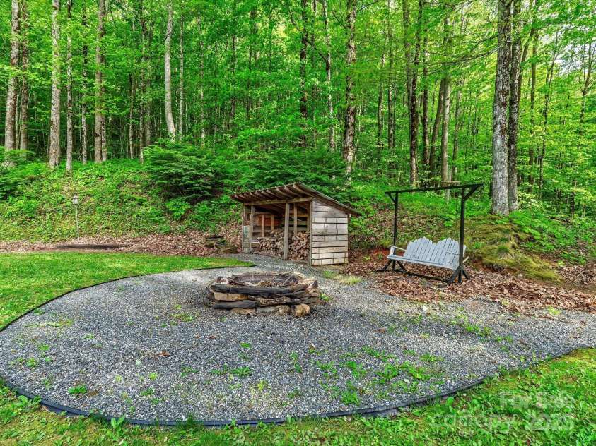 287 Sara Ridge Road, Waynesville, NC 28786.  MLS# CAR4260530, YatesRealty ID 21997. Huge firepit area just in time for summer nights