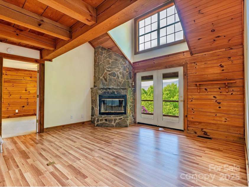287 Sara Ridge Road, Waynesville, NC 28786.  MLS# CAR4260530, YatesRealty ID 21997. Living room looking towards the primary bedroom