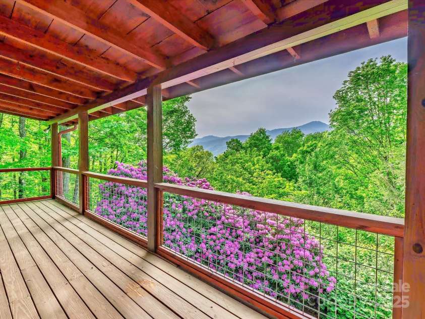 287 Sara Ridge Road, Waynesville, NC 28786.  MLS# CAR4260530, YatesRealty ID 21997. Year-round mountain views and huge rhododendron