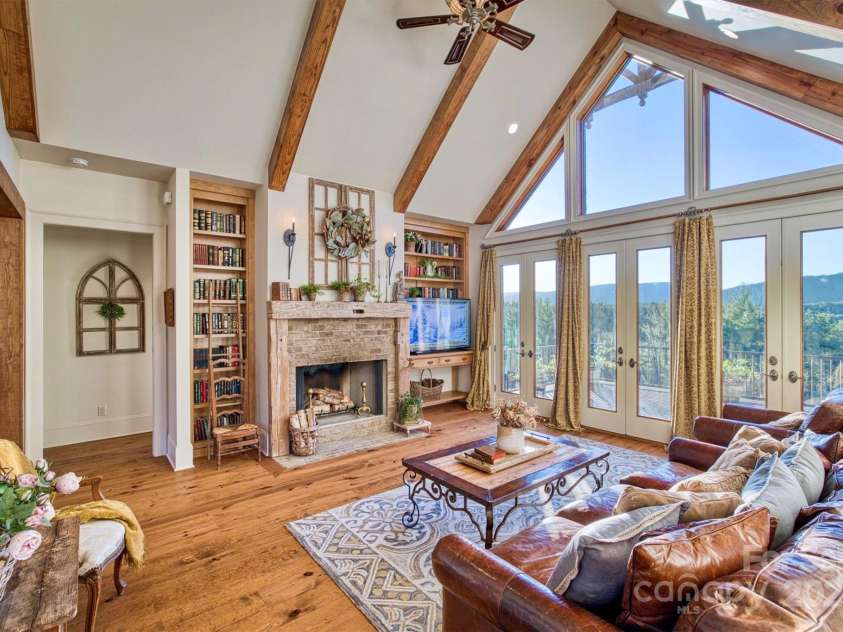 5608 Table View Lane, Lenoir, NC 28645.  MLS# CAR4232931, YatesRealty ID 2200. Beamed cathedral ceilings and a wall of windows and French doors create a bright airy great room.  A magnificent Blue Ridge Mountain view spans the horizon.  Sunsets are spectacular.