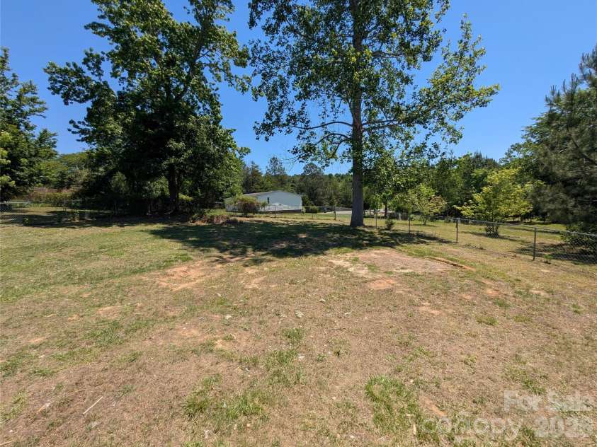 2032 Rocky Creek Lane, Dallas, NC 28034.  MLS# CAR4377210, YatesRealty ID 22007. Back yard