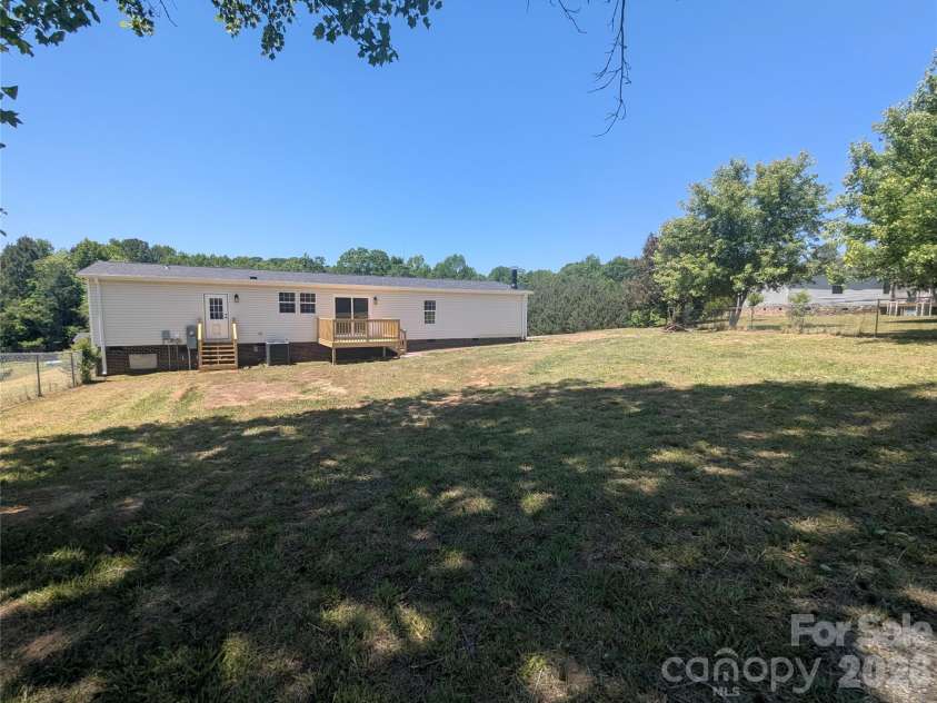 2032 Rocky Creek Lane, Dallas, NC 28034.  MLS# CAR4377210, YatesRealty ID 22007. Back yard