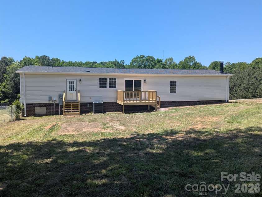 2032 Rocky Creek Lane, Dallas, NC 28034.  MLS# CAR4377210, YatesRealty ID 22007. Rear exterior