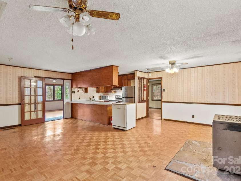 61 Doe Loop, Hot Springs, NC 28743.  MLS# CAR4295989, YatesRealty ID 2201. Open Living/Dining/Kitchen w/parquet wood floors. Uninstalled dishwater to remain or can be removed.