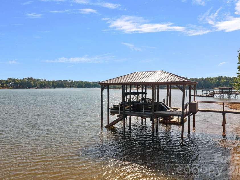 107 Beachview Drive, Mooresville, NC 28117.  MLS# CAR4377535, YatesRealty ID 22019. Covered dock with 10,000lb. lift