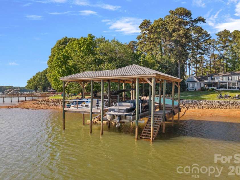 107 Beachview Drive, Mooresville, NC 28117.  MLS# CAR4377535, YatesRealty ID 22019. Covered dock with year-round deep water