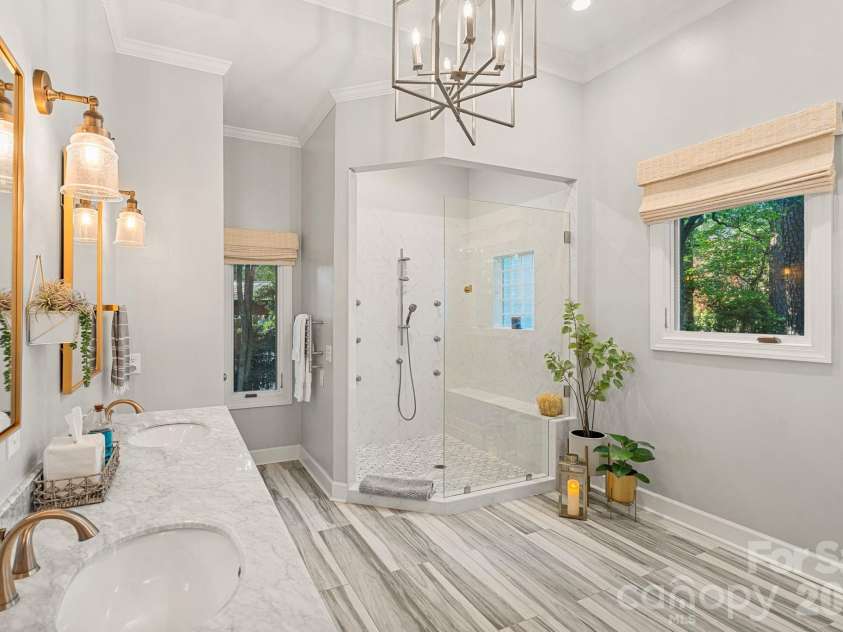107 Beachview Drive, Mooresville, NC 28117.  MLS# CAR4377535, YatesRealty ID 22019. Expansive shower with custom shower heads