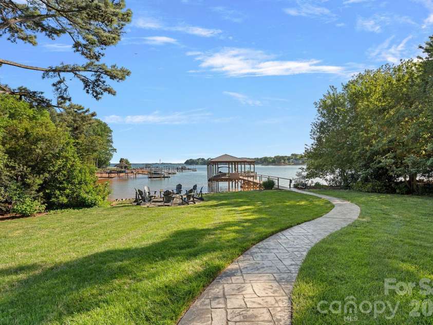 107 Beachview Drive, Mooresville, NC 28117.  MLS# CAR4377535, YatesRealty ID 22019. Gentle sloped yard leads you to paradise