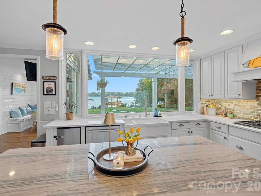 107 Beachview Drive, Mooresville, NC 28117.  MLS# CAR4377535, YatesRealty ID 22019. Inside are more lake views for inspired cooking