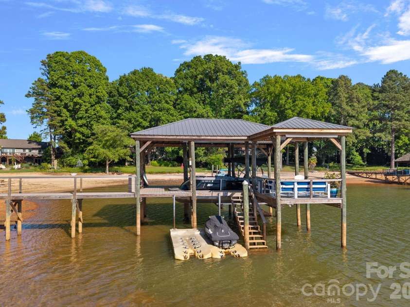 107 Beachview Drive, Mooresville, NC 28117.  MLS# CAR4377535, YatesRealty ID 22019. Jet ski lift and stairs for water access