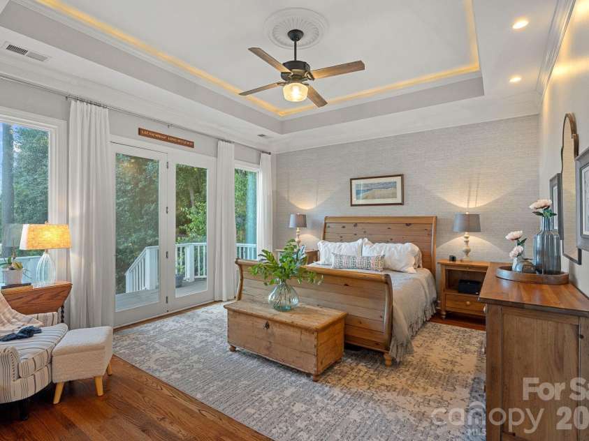 107 Beachview Drive, Mooresville, NC 28117.  MLS# CAR4377535, YatesRealty ID 22019. Main level primary filled with peaceful lake views