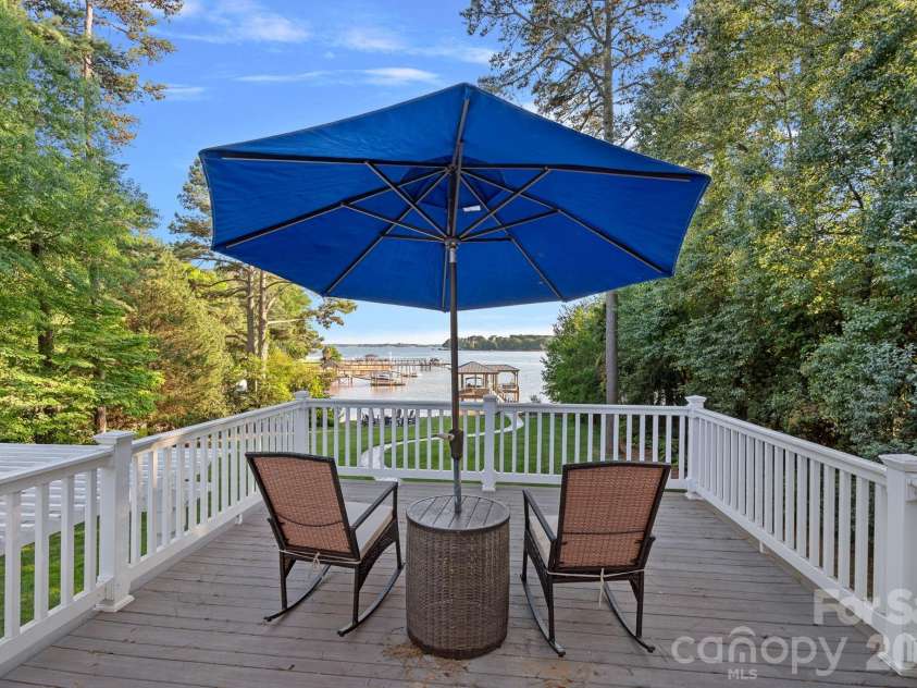 107 Beachview Drive, Mooresville, NC 28117.  MLS# CAR4377535, YatesRealty ID 22019. Private balcony for quiet lakeside reflection