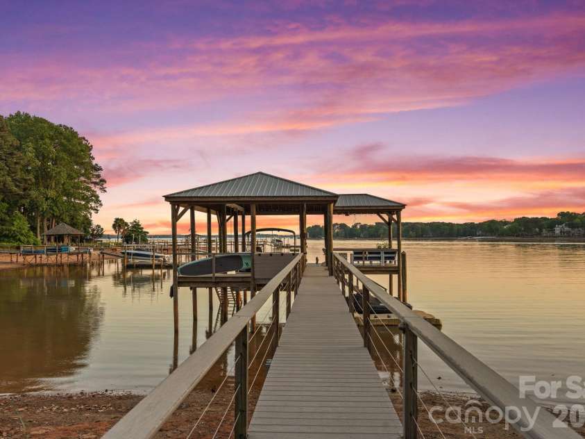 107 Beachview Drive, Mooresville, NC 28117.  MLS# CAR4377535, YatesRealty ID 22019. Sunset views from your private Lake Norman dock