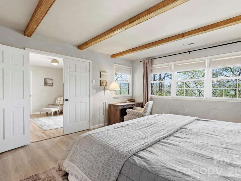821 Summit Drive, Maggie Valley, NC 28751.  MLS# CAR4371108, YatesRealty ID 22022. Master bed