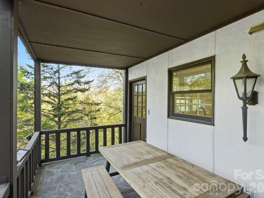 821 Summit Drive, Maggie Valley, NC 28751.  MLS# CAR4371108, YatesRealty ID 22022. Second floor covered balcony