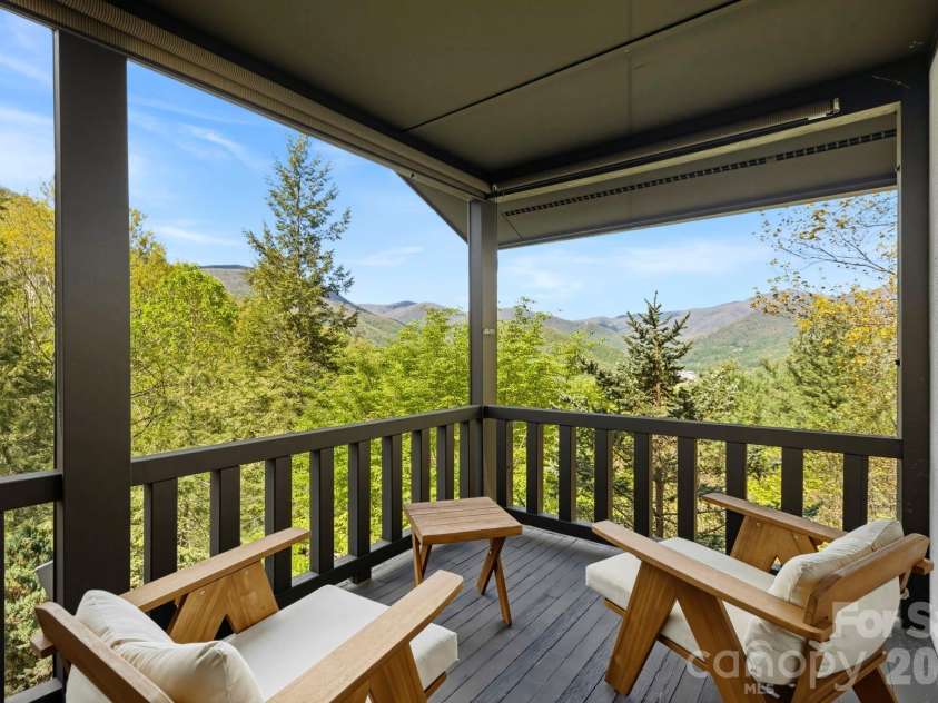 821 Summit Drive, Maggie Valley, NC 28751.  MLS# CAR4371108, YatesRealty ID 22022. Third  floor covered balcony