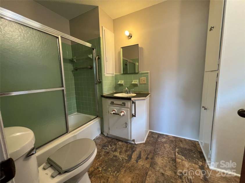 179 Sunnyside Street, Forest City, NC 28043.  MLS# CAR4238466, YatesRealty ID 22026. Master bath