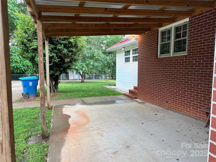 179 Sunnyside Street, Forest City, NC 28043.  MLS# CAR4238466, YatesRealty ID 22026. Side covered porch off Kitchen