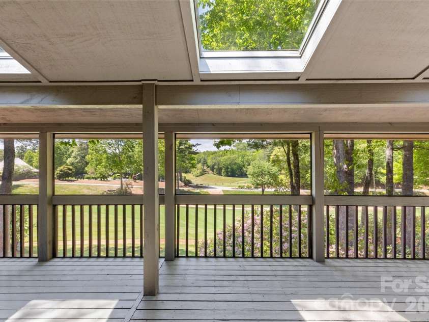 84 Fairway Villas Drive, Sapphire, NC 28774.  MLS# CAR4381824, YatesRealty ID 22026. Three skylights on back porch