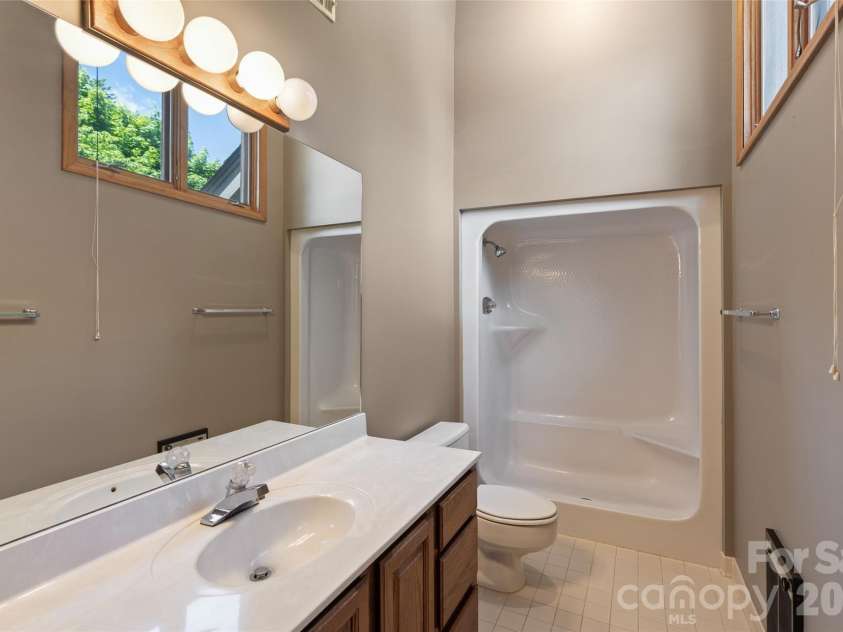 84 Fairway Villas Drive, Sapphire, NC 28774.  MLS# CAR4381824, YatesRealty ID 22026. Upstairs bath