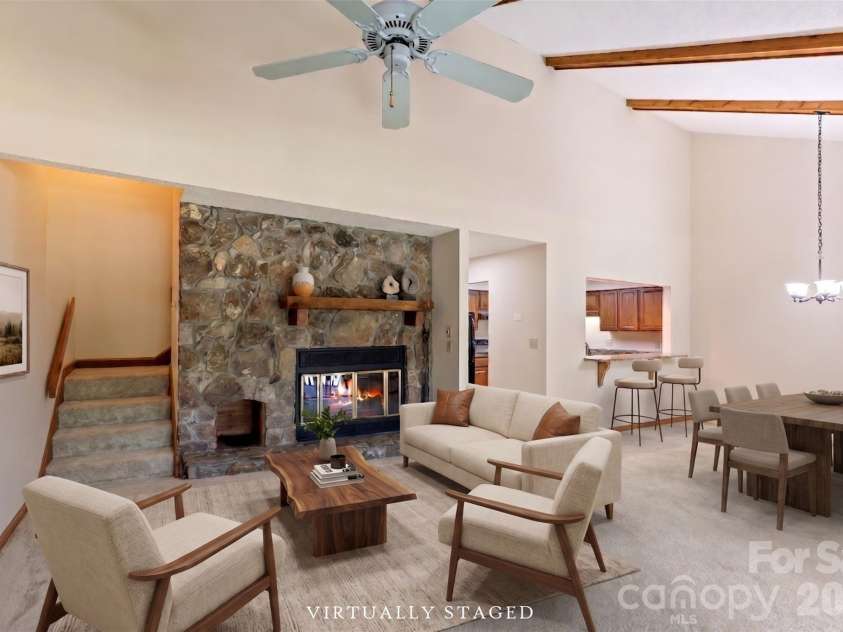 84 Fairway Villas Drive, Sapphire, NC 28774.  MLS# CAR4381824, YatesRealty ID 22026. Virtually staged Living dining area