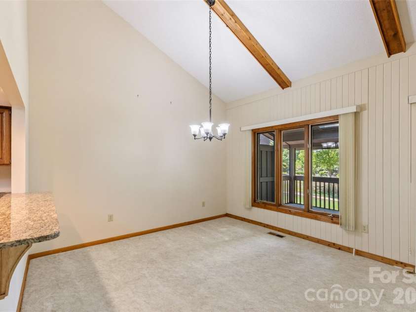 84 Fairway Villas Drive, Sapphire, NC 28774.  MLS# CAR4381824, YatesRealty ID 22026. Windows across the back for the views
