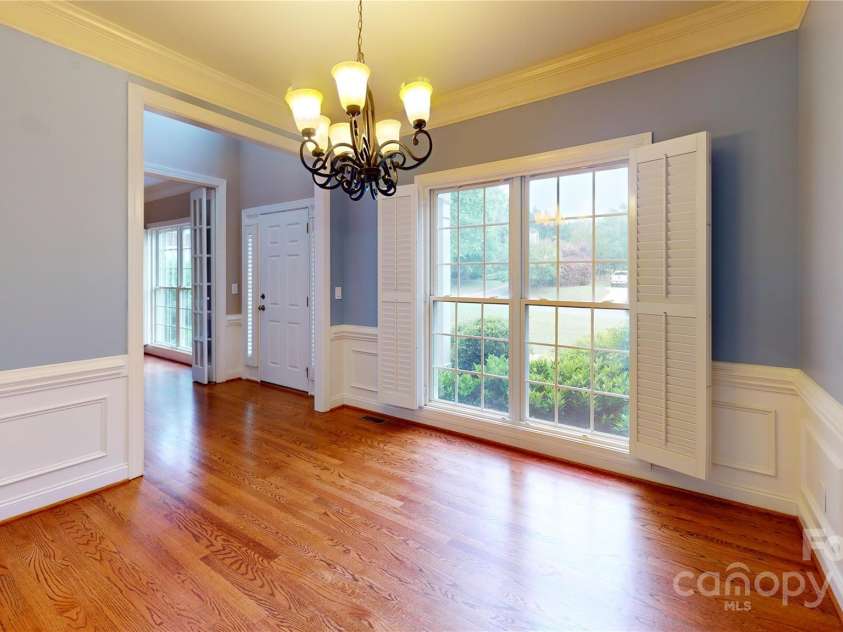4066 Belle Meade Circle, Belmont, NC 28012.  MLS# CAR4255960, YatesRealty ID 22029. Dining room features moulding.