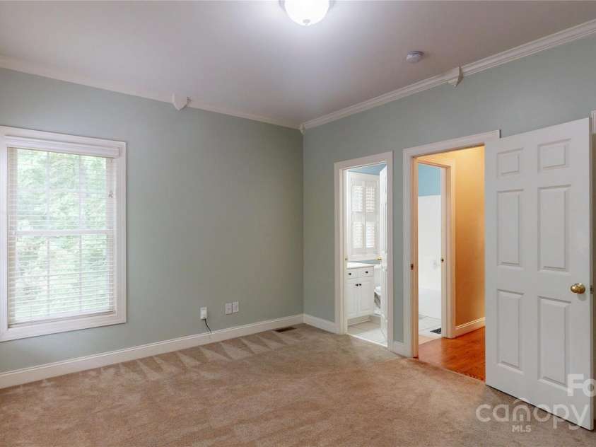 4066 Belle Meade Circle, Belmont, NC 28012.  MLS# CAR4255960, YatesRealty ID 22029. Downstairs bedroom with adjacent full bath.