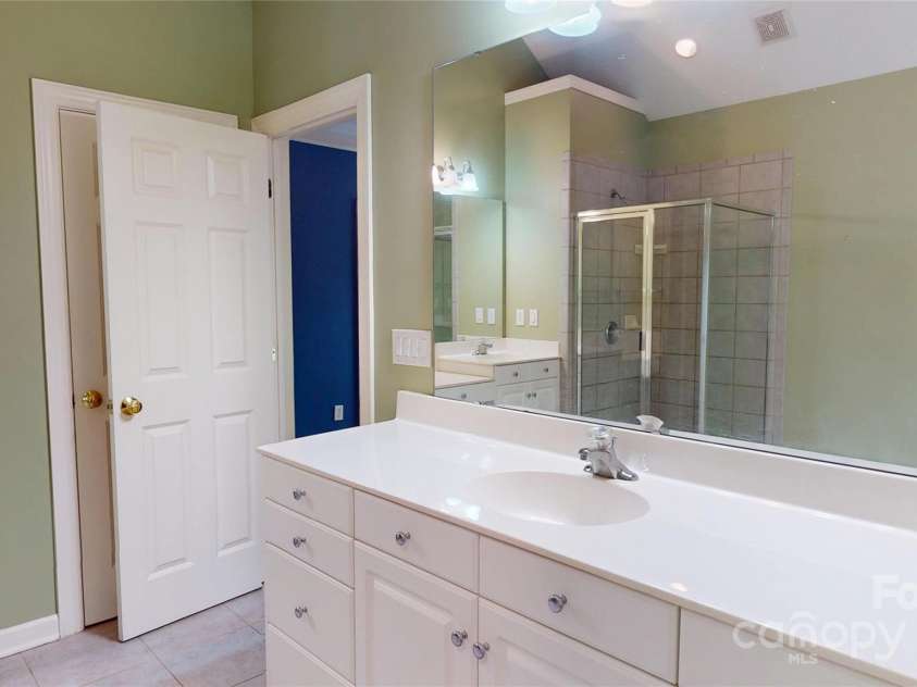 4066 Belle Meade Circle, Belmont, NC 28012.  MLS# CAR4255960, YatesRealty ID 22029. Large primary bath with his/her vanities.