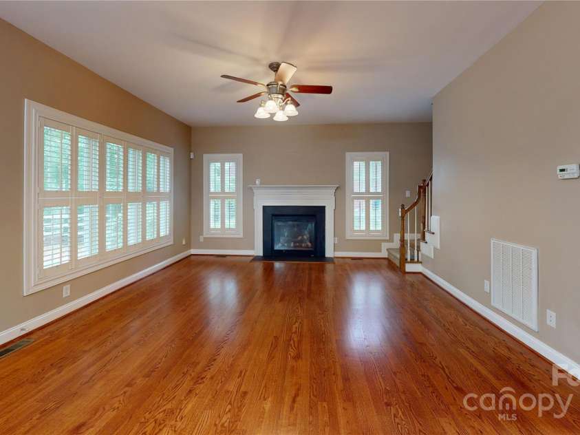 4066 Belle Meade Circle, Belmont, NC 28012.  MLS# CAR4255960, YatesRealty ID 22029. Open concept great room with gorgeous views of the trees.