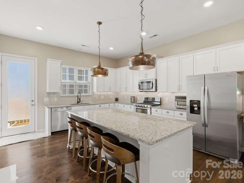 9812 Ainslie Downs Street, Charlotte, NC 28273.  MLS# CAR4375661, YatesRealty ID 22029. Kitchen with large island