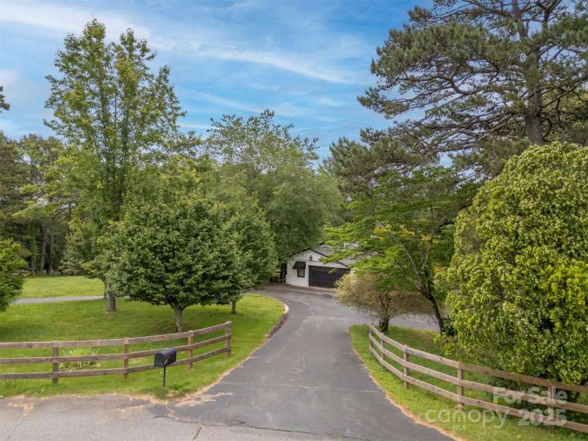 64 Persimmon Hill Drive, Columbus, NC 28722.  MLS# CAR4257157, YatesRealty ID 22038. Entrance Driveway