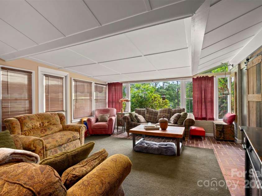 64 Persimmon Hill Drive, Columbus, NC 28722.  MLS# CAR4257157, YatesRealty ID 22038. Family/Sun Room