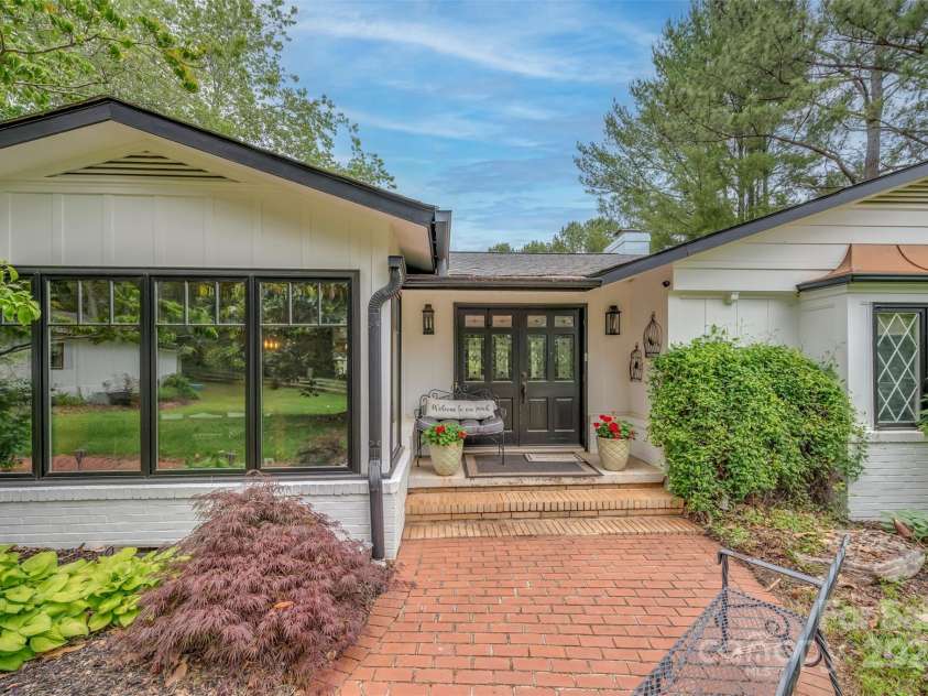 64 Persimmon Hill Drive, Columbus, NC 28722.  MLS# CAR4257157, YatesRealty ID 22038. Front View w/ double doors