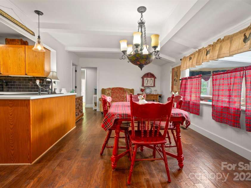64 Persimmon Hill Drive, Columbus, NC 28722.  MLS# CAR4257157, YatesRealty ID 22038. Kitchen with Beadboard Cabinetry & wood flooring