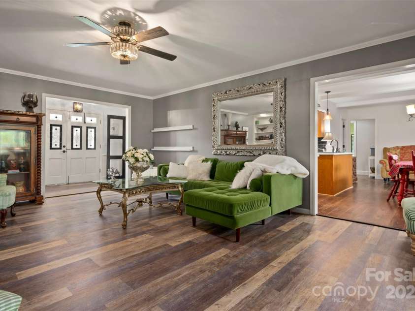 64 Persimmon Hill Drive, Columbus, NC 28722.  MLS# CAR4257157, YatesRealty ID 22038. Living Room w/ kitchen in the background