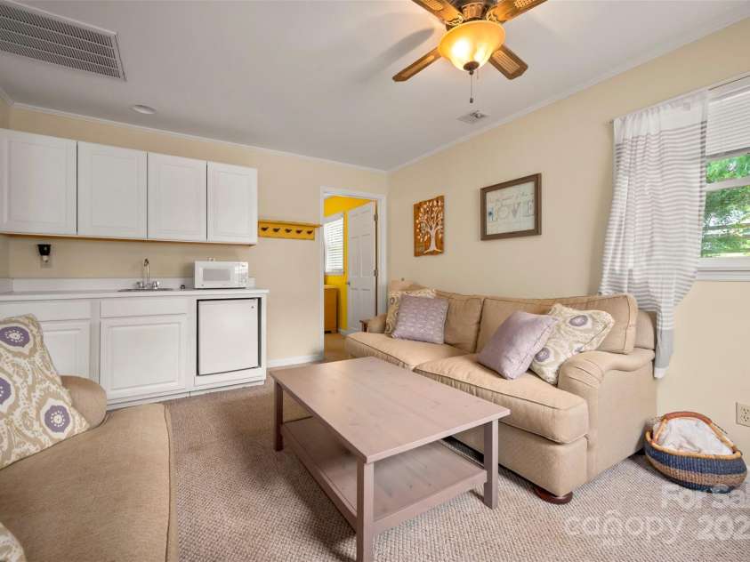 64 Persimmon Hill Drive, Columbus, NC 28722.  MLS# CAR4257157, YatesRealty ID 22038. Living Room w/ sink & mini fridge