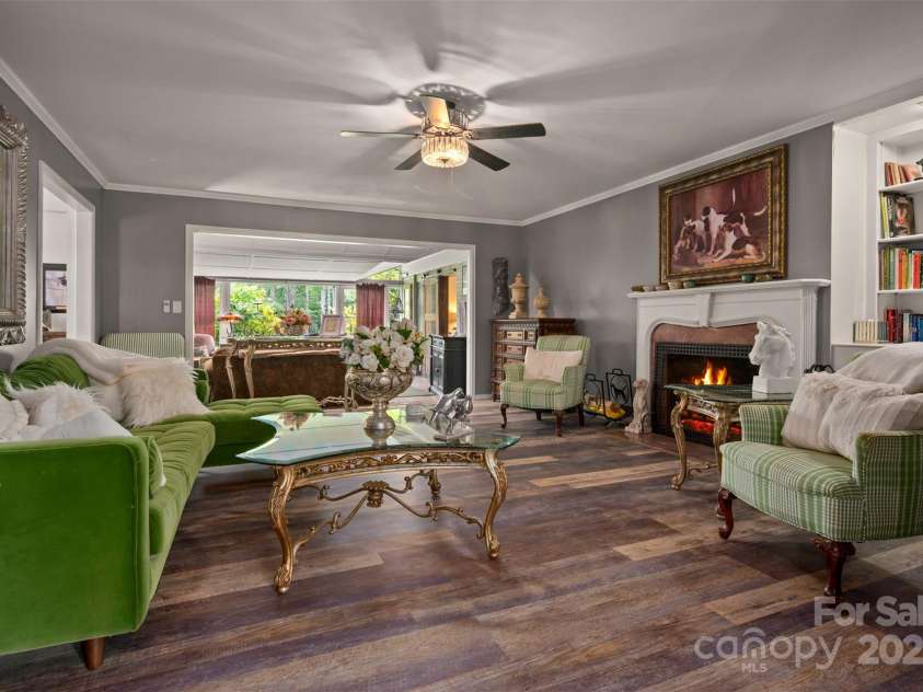 64 Persimmon Hill Drive, Columbus, NC 28722.  MLS# CAR4257157, YatesRealty ID 22038. Living Room w/ wood burning fireplace